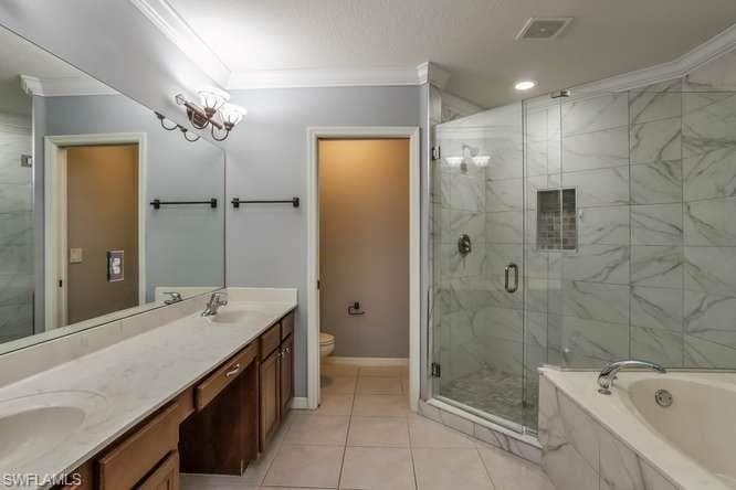 Primary bathroom with walk in shower & garden tub