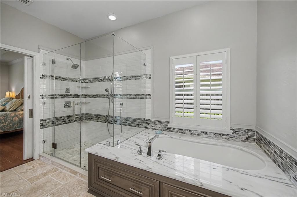Huge Primary Bath with double lav, separate shower and tub