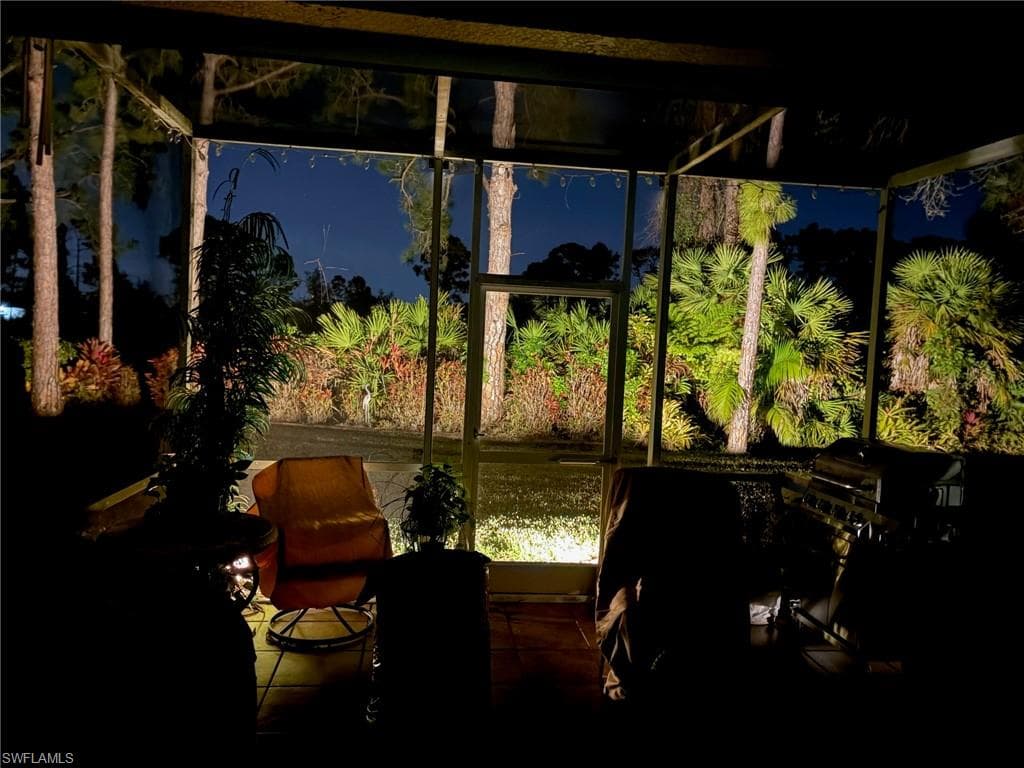 Evening view from lanai looking at landscaped yard