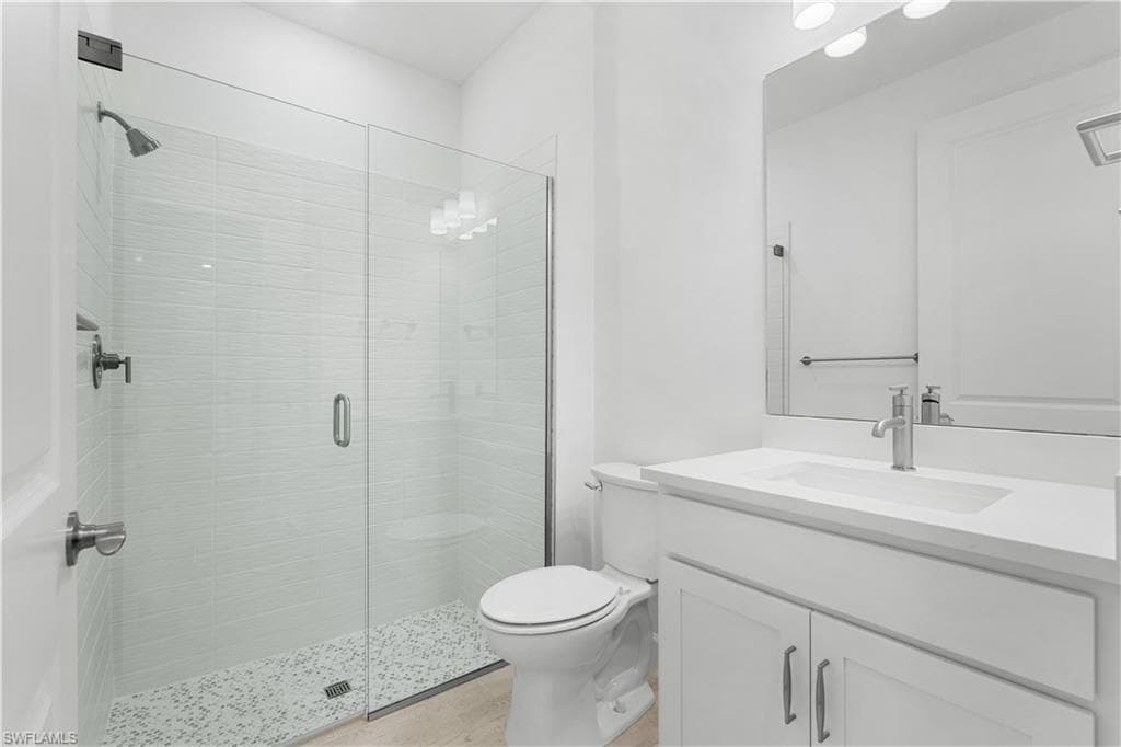 guest bathroom with frameless shower door