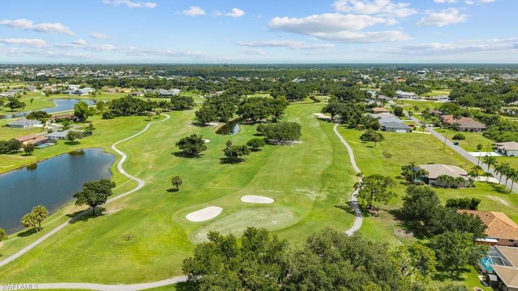 Expansive golf course setting featuring lush fairways, greens, and sand traps