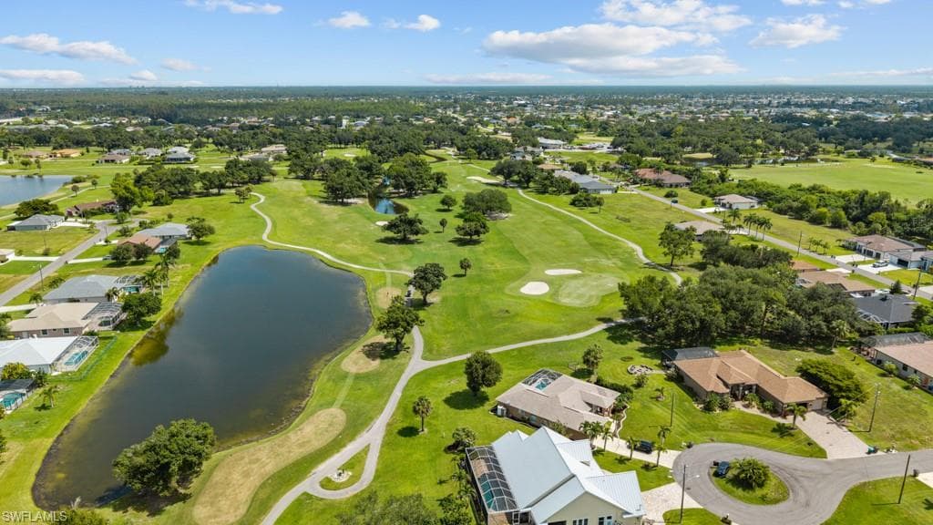Expansive aerial perspective showcasing a golf course environment with multiple residential properties