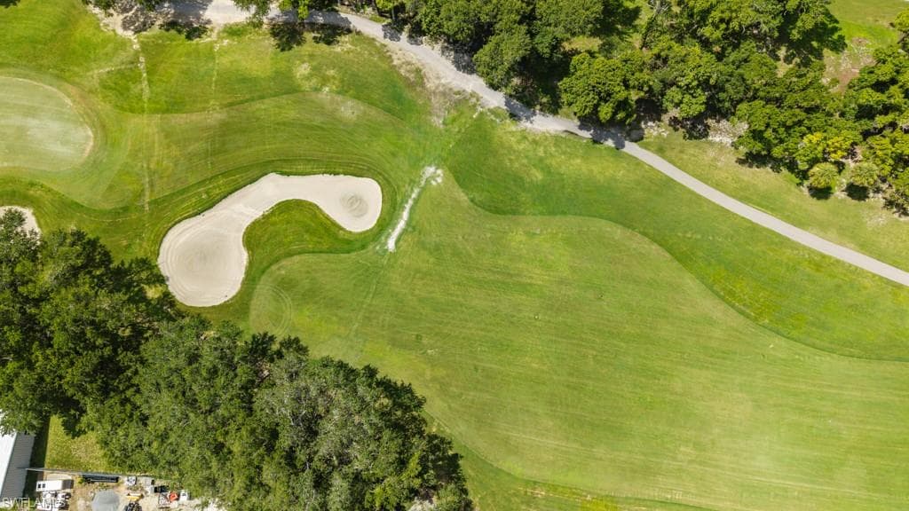 Expansive golf course terrain featuring manicured greens and sand traps