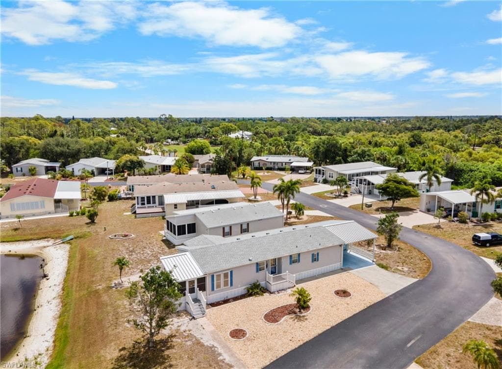 Aerial perspective showcasing a community of homes with a natural landscape backdrop