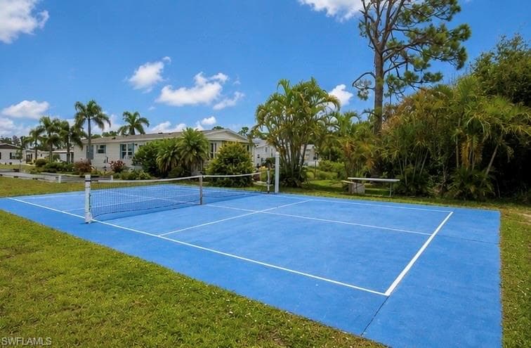 Sport court with blue surface and white demarcation lines