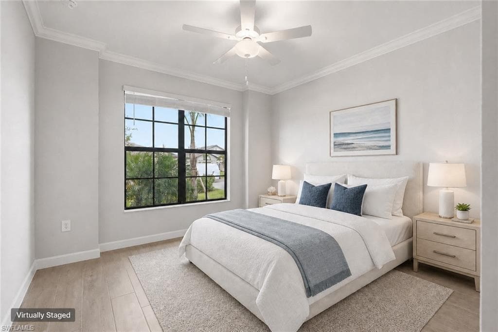 Bedroom featuring a large multi-pane window, wood-finish flooring, crown molding, and a ceiling fan with integrated lighting