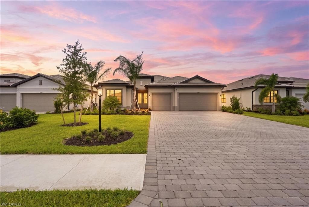 Contemporary single-story residence with a paver driveway