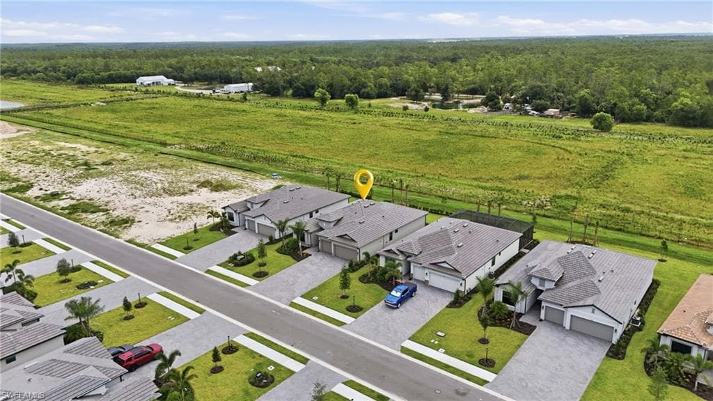 Aerial perspective showcasing a residential street with uniform contemporary homes