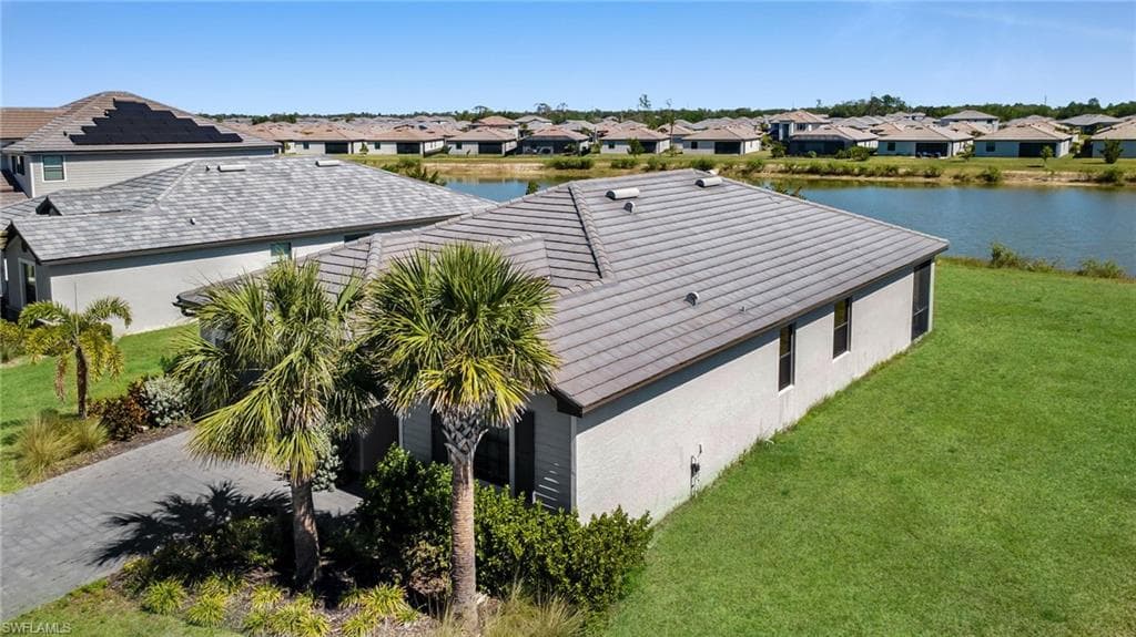 Bird's eye view with a water view and a residential view