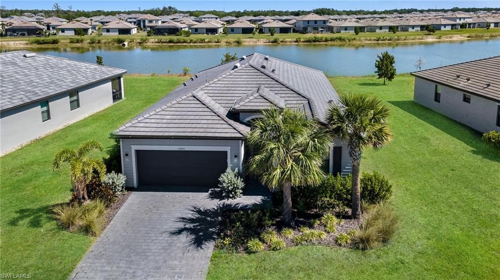 Aerial view with a residential view and a water view