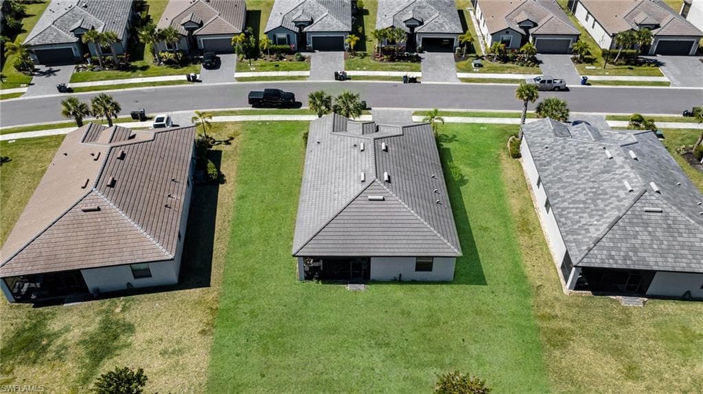 Birds eye view of property with a residential view