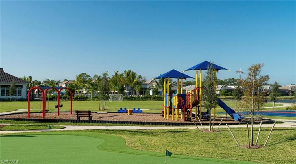 Community jungle gym with a yard