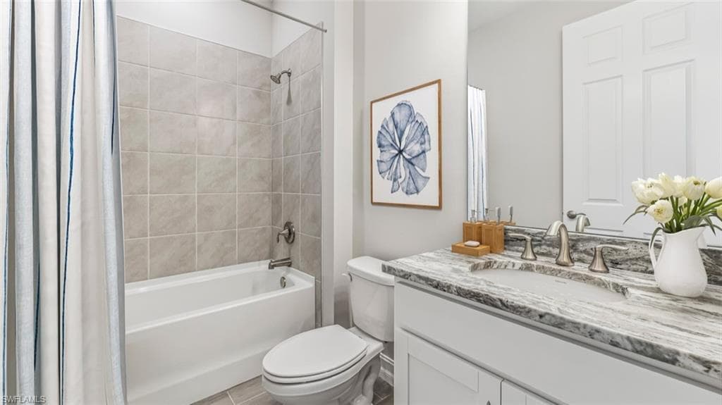 This image is virtually staged. Bathroom with vanity and shower / tub combo with curtain