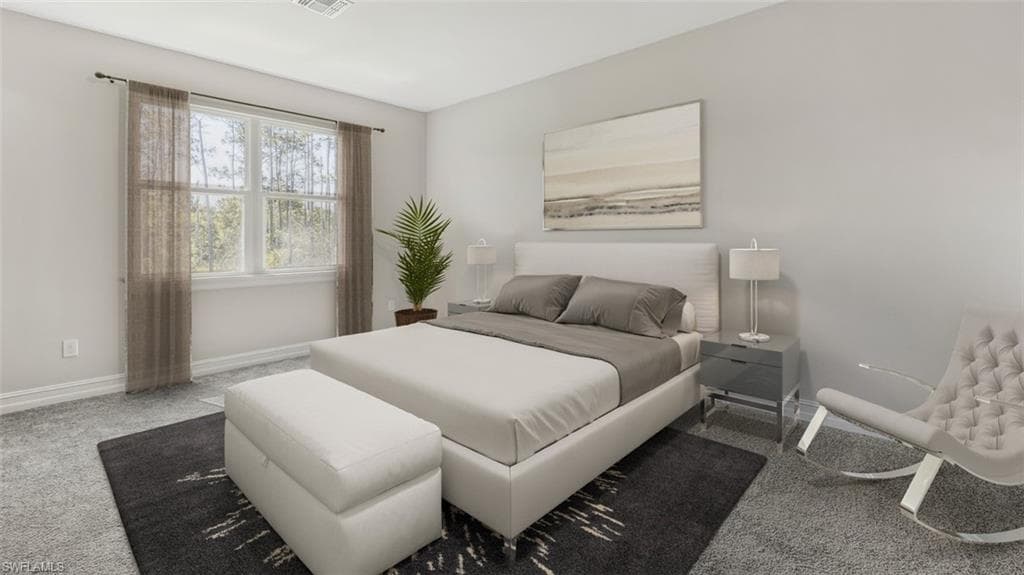 This image is virtually staged. Bedroom with carpet flooring and baseboards