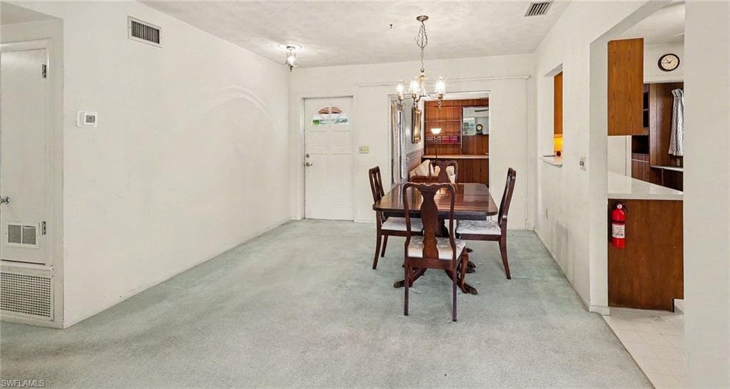 Dining between entry, kitchen, family and living rooms