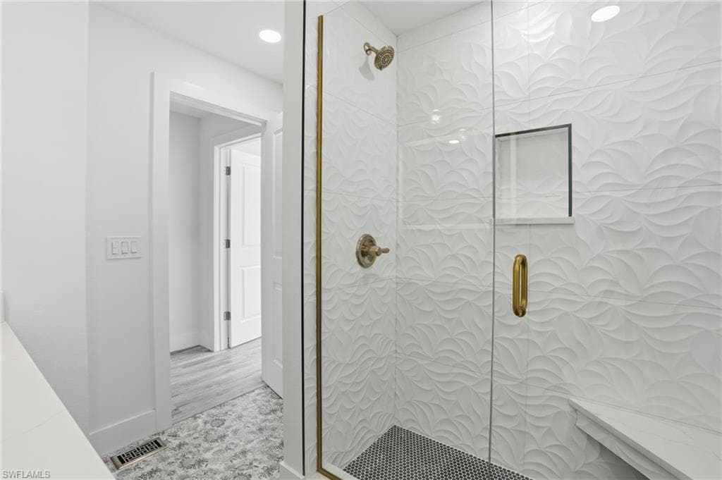 Full bath featuring tiled shower and recessed lighting - Virtually Edited Image
