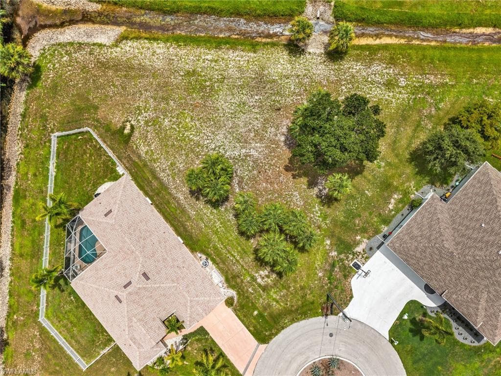 Expansive residential lot featuring mature trees and green space