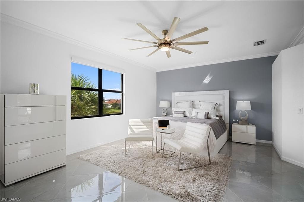 Spacious room featuring large format tile flooring, crown molding, a modern ceiling fan with integrated lighting, and a prominent window with a black frame