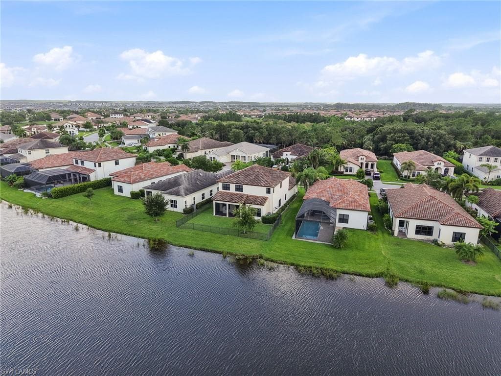 Waterside residential community featuring Mediterranean-inspired homes with tile roofs