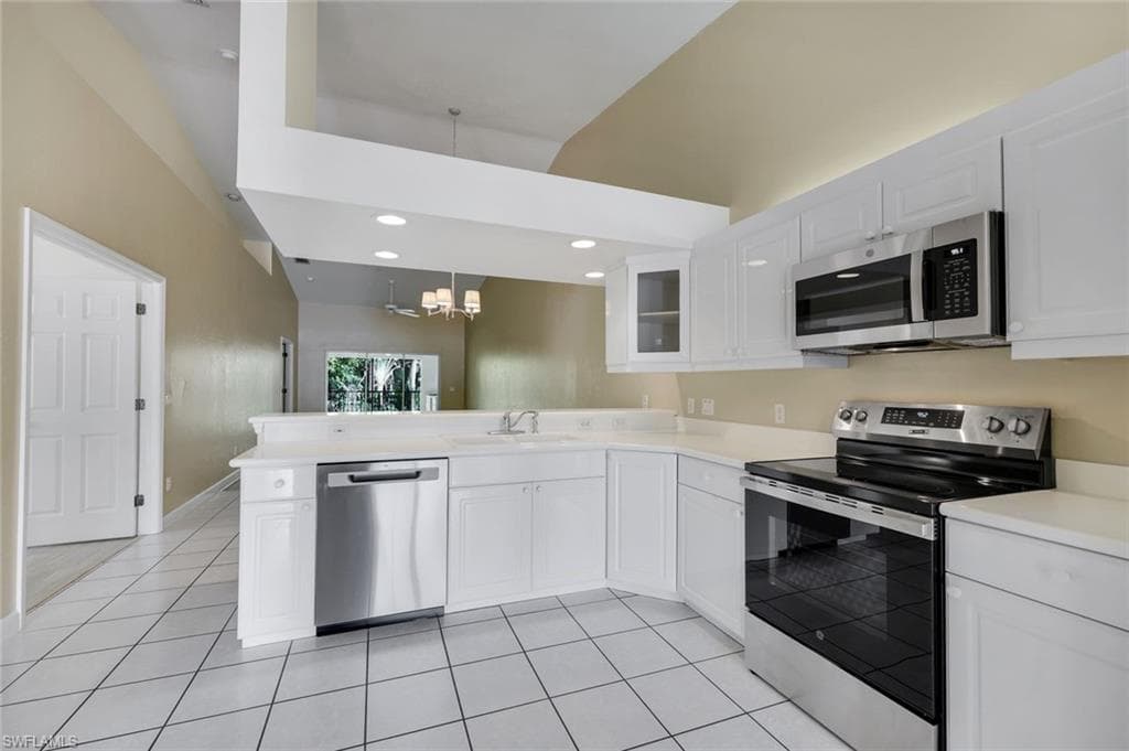 KITCHEN WITH JUST INSTALLED STAINLESS STEEL APPLIANCES