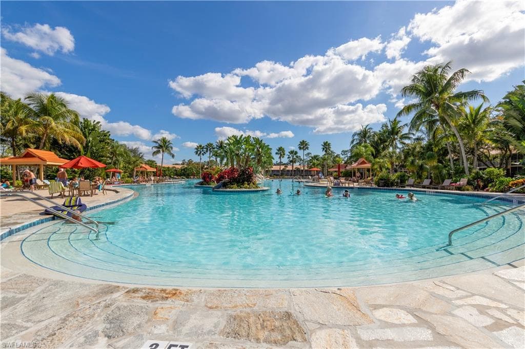THE LARGE, 11,000 SF, SALT WATER FILTERED POOL WITH LUSH LANDSCAPING AND 86 DEGREE WATER FOR YOUR ENJOYMENT!!!!!