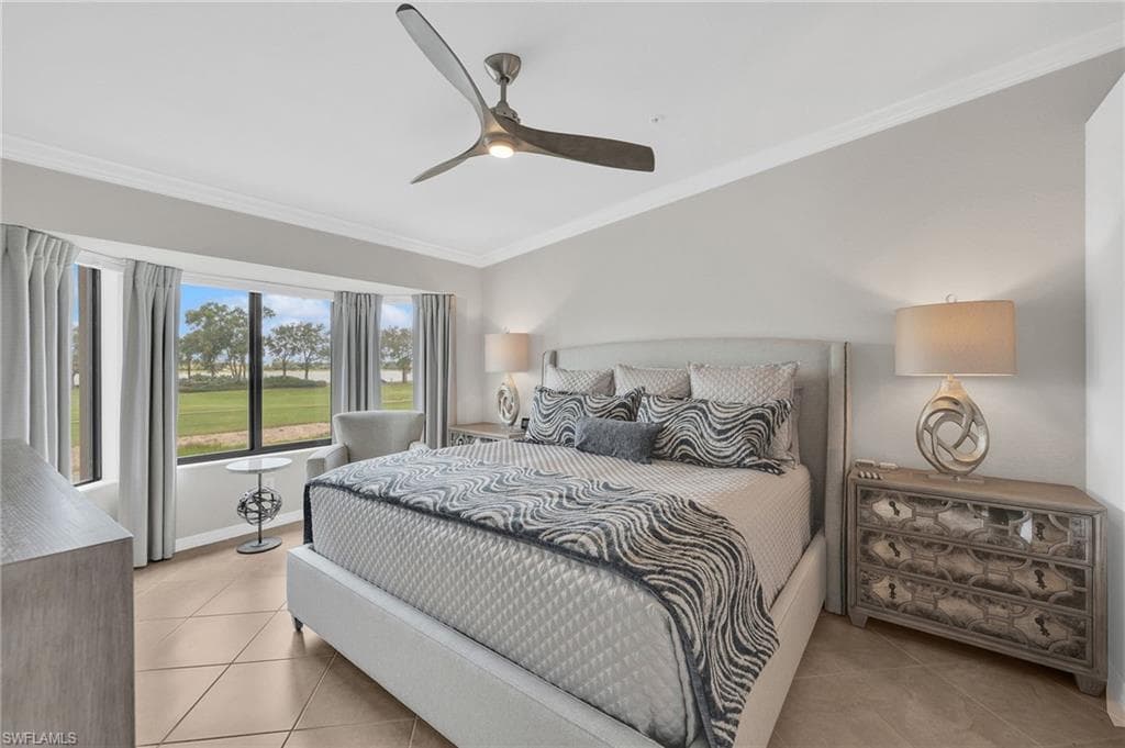 Primary bedroom with views of golf and lake.