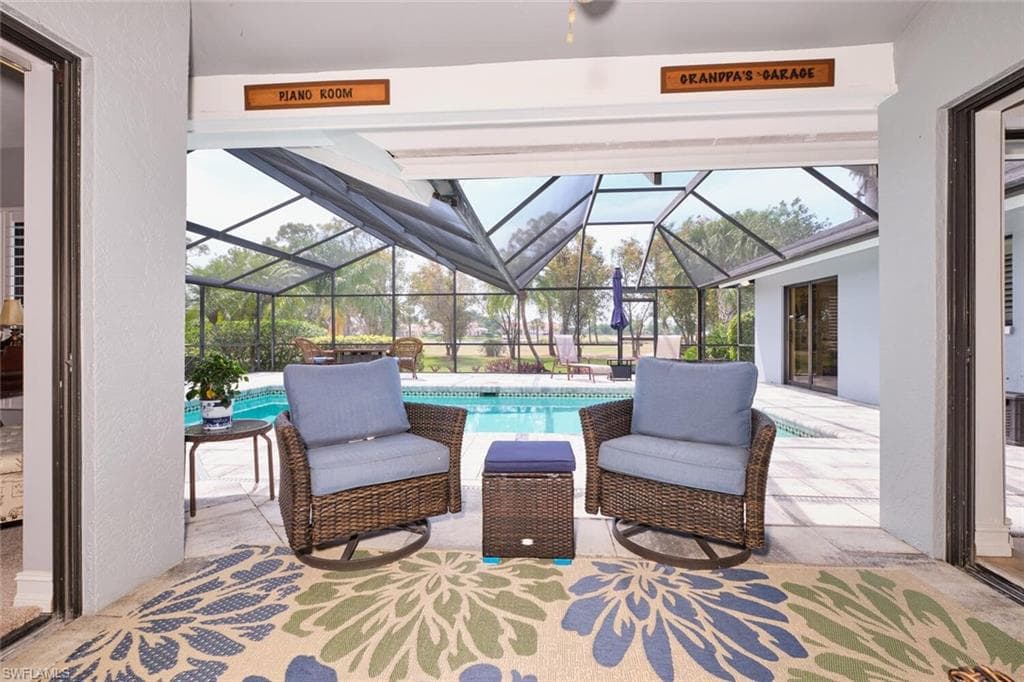 View of patio featuring an outdoor pool and screen enclosure