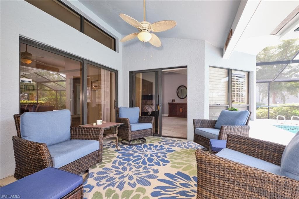 Quaint undercover area of the lanai where you can watch the golfers go by.