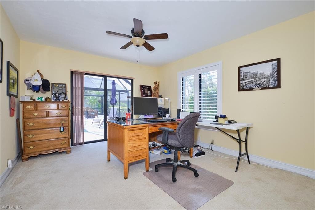 Guest bedroom (currently used as an office) has sliders out to the screened lanai.