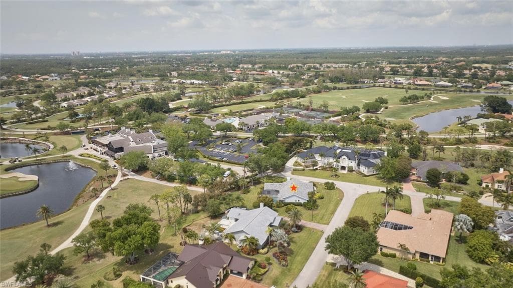 Birds eye view of property with a residential view, golf course view, and a water view