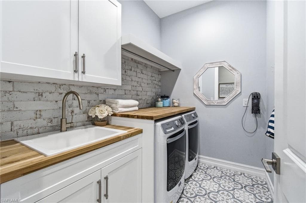 Custom mud room/ laundry is situated off of the owners entry/3 car garage.