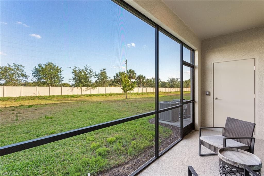 The southeast-facing screened lanai provides serene sunrise views and extra outdoor storage, all overlooking beautifully landscaped green space