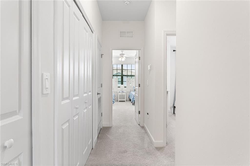 Bright upstairs hallway offering easy access to the bedrooms, bathrooms, and ample closet storage