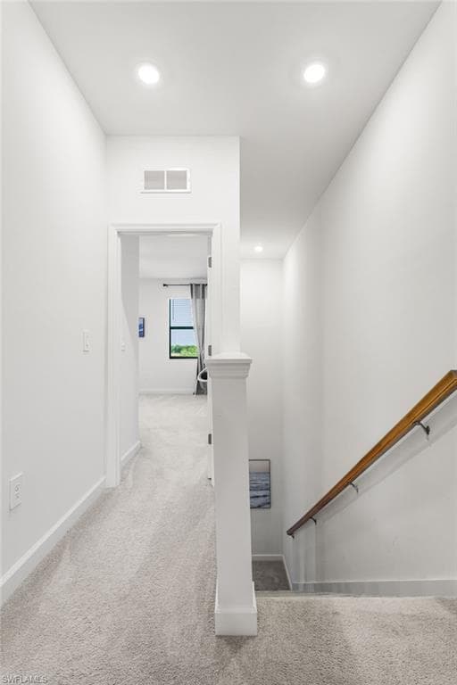 Bright upstairs hallway with recessed lighting, connecting the bedrooms and living spaces with ease
