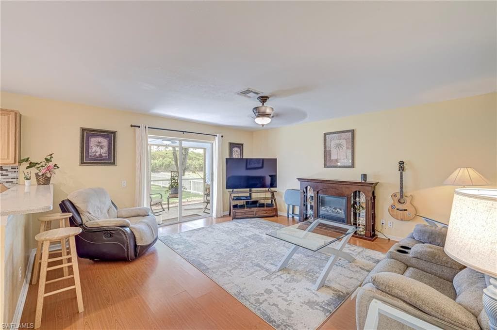 Family room open to the kitchen and large backyard.