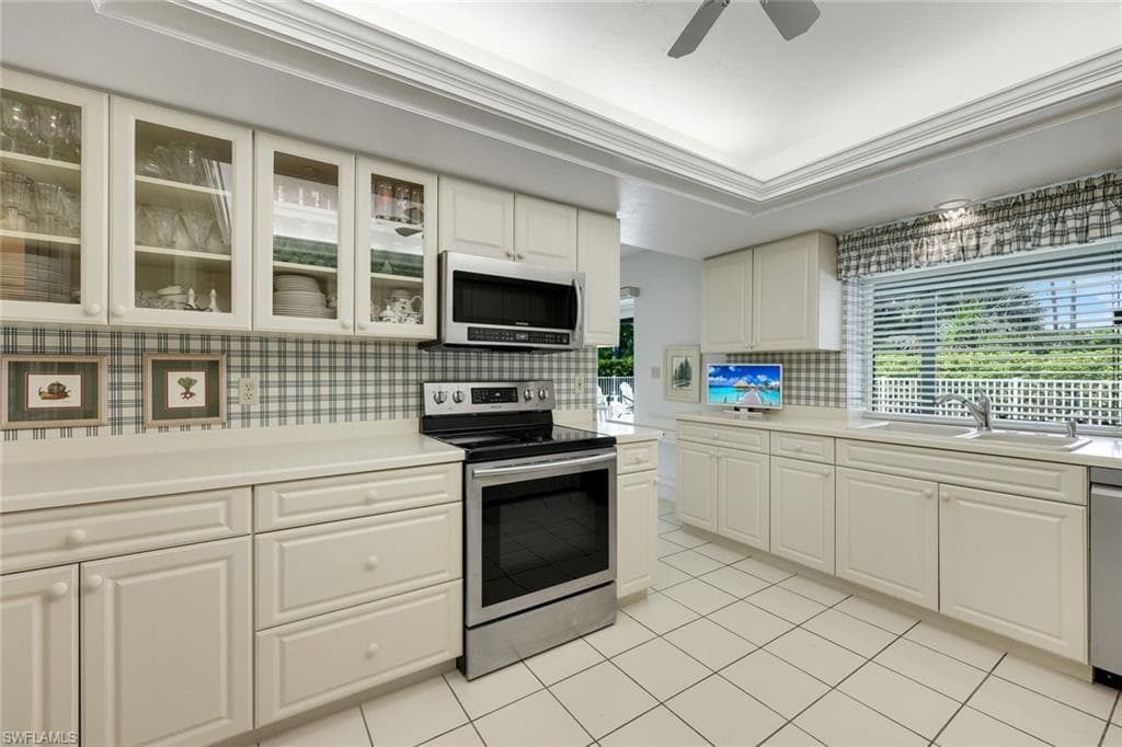 Prepare meals while enjoying pool views.