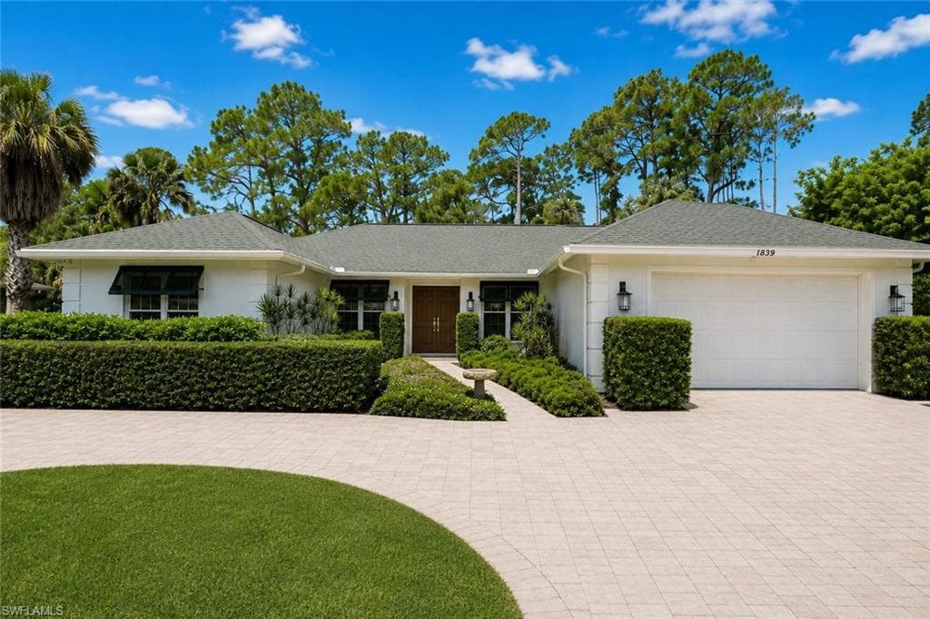 Impeccably maintained pool home in the coveted neighborhood of Imperial Golf Estates!