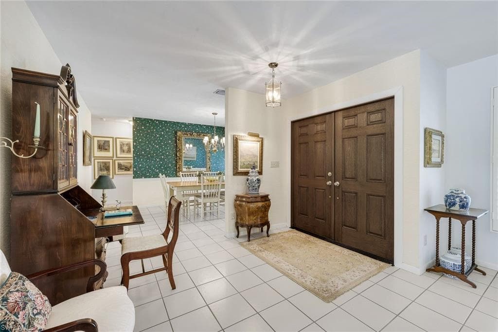 Grand entryway leading to the formal living and dining areas. This home is perfect for entertaining friends and family!