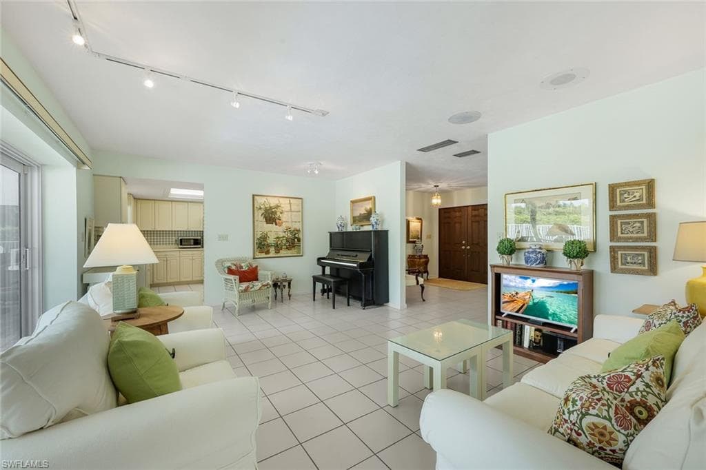 View of kitchen and entry way from the living room.