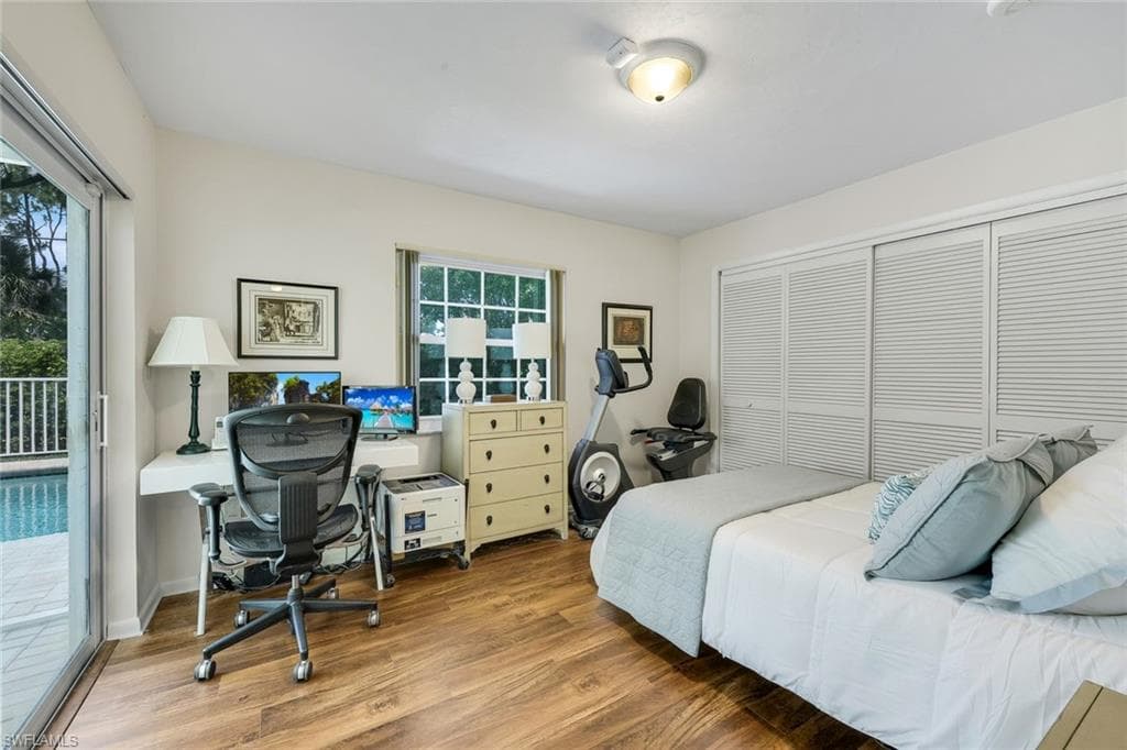 Fourth guest bedroom offers lanai/pool access.