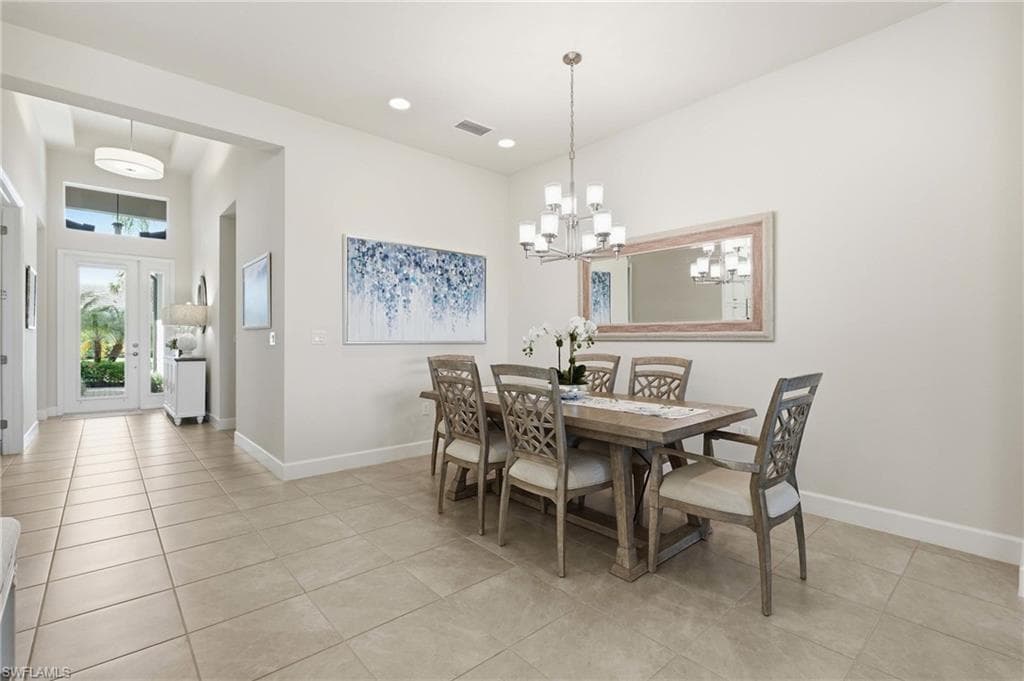 Spacious dining area features stunning chandelier.