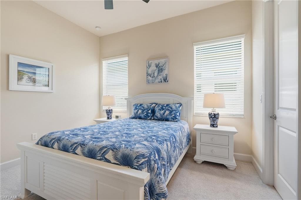 Guest bedroom is carpeted. The home has neutral tones throughout to any decor.