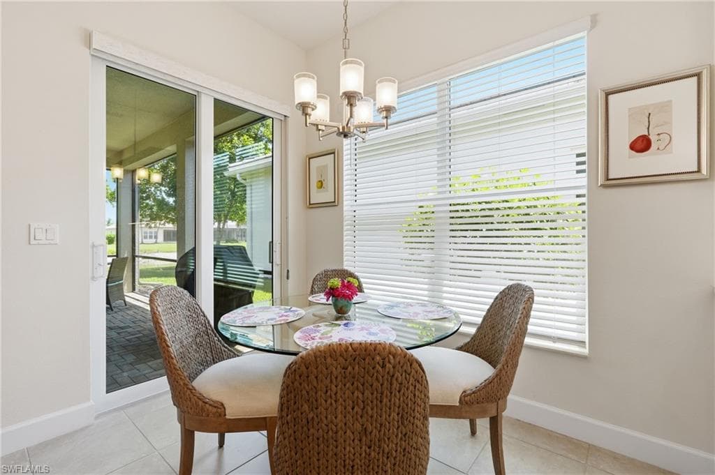Tile flooring and beautiful Chandelier accents the breakfast nook.