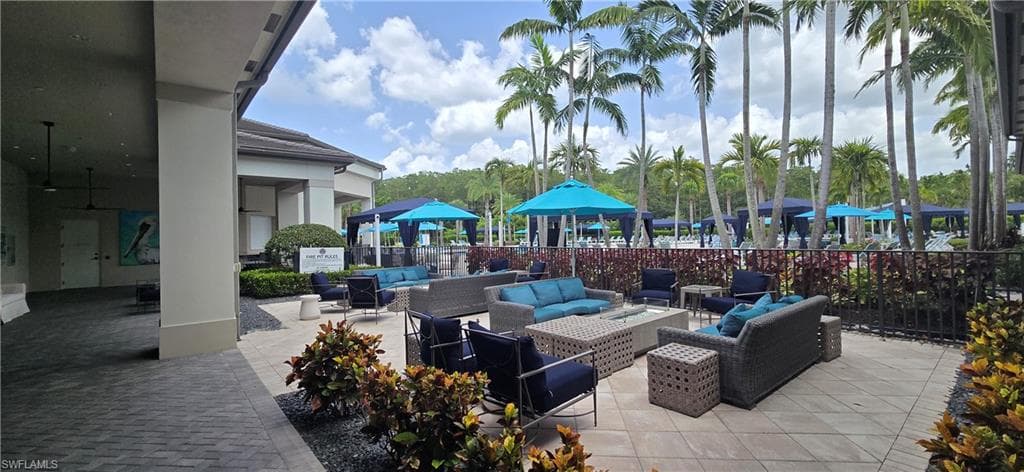 Community Fire Pit with paver patio, multiple seating areas and lush landscaping
