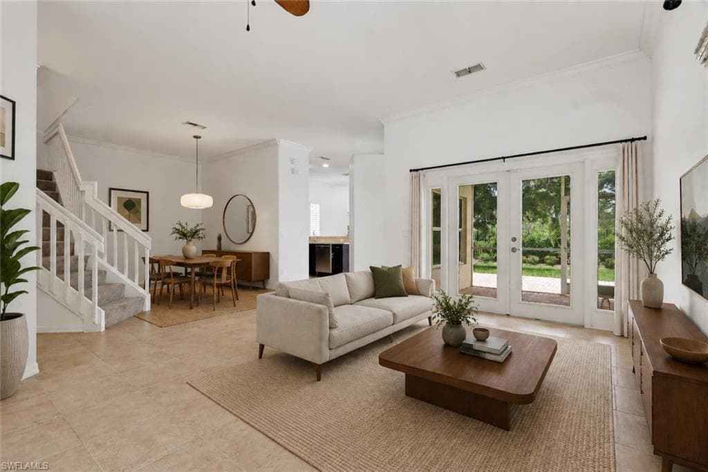 Virtually staged living room, dining room and entryway