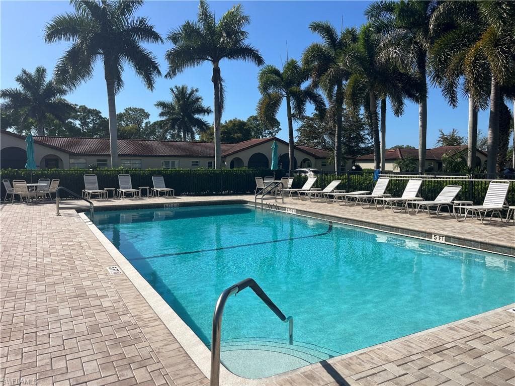 Community pool with a patio area