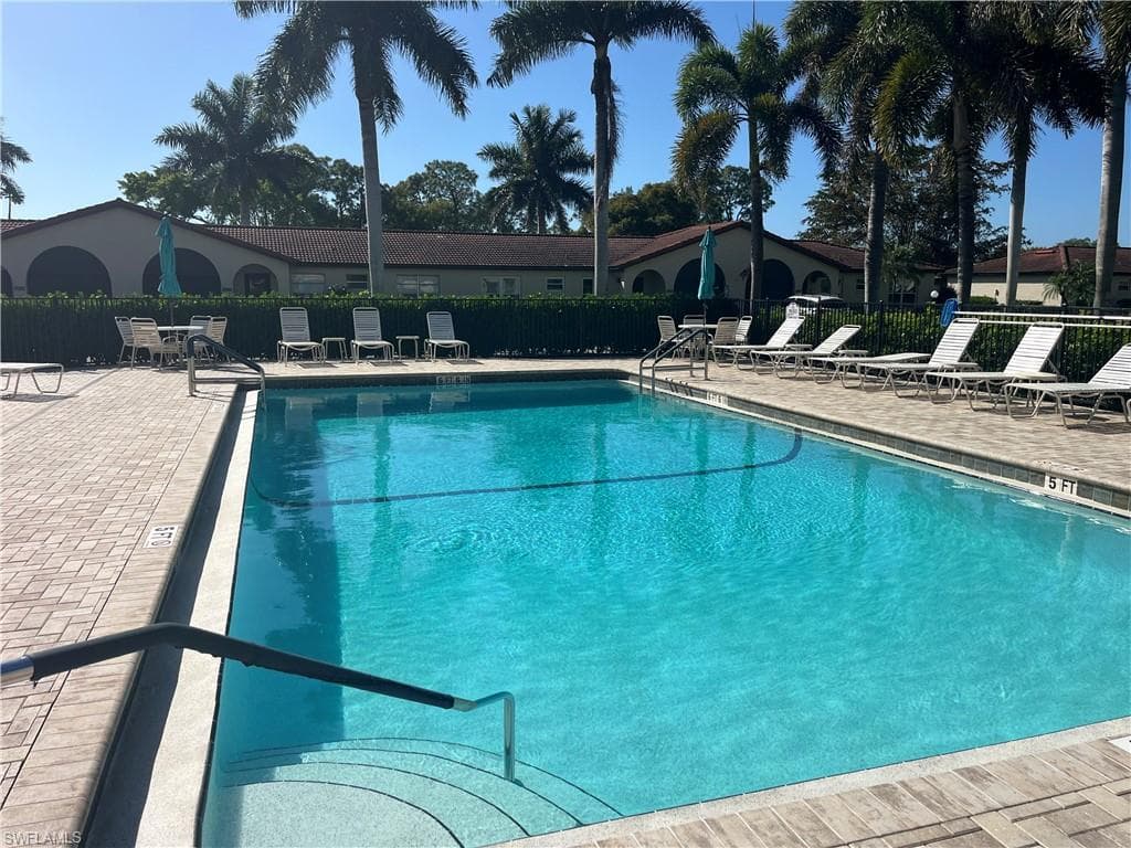 Community pool with a patio area