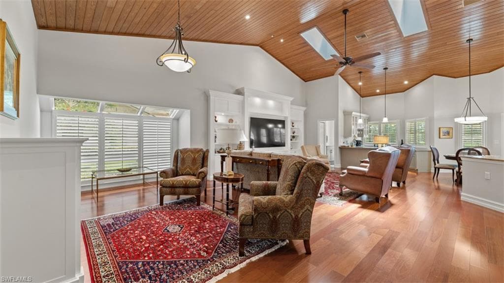 Vaulted wood-paneled ceilings with skylights