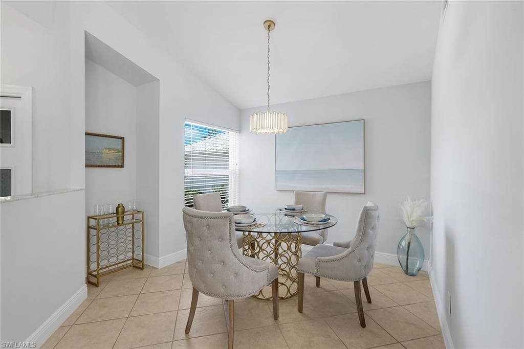 Updated spacious kitchen with white shaker cabinetry, quartz counters and stainless steel appliances