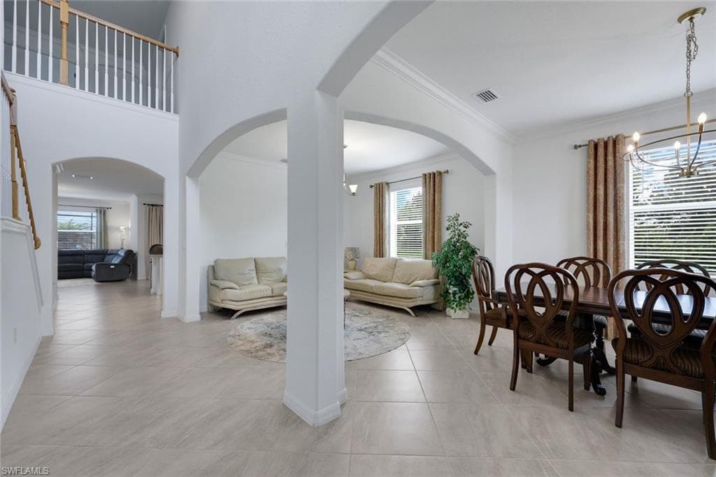 formal dining and sitting areas opens to kitchen and family rooms